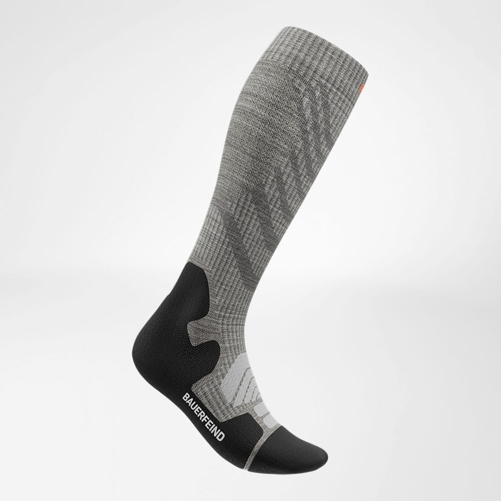 Gray and black knee-high sock with 'Bauerfeind' branding on a white background