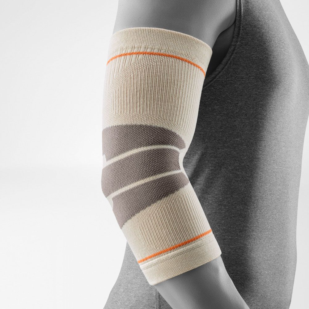 A close-up of a person's arm wearing a Bauerfeind Sports outdoor elbow compression sleeve with a light gray background.