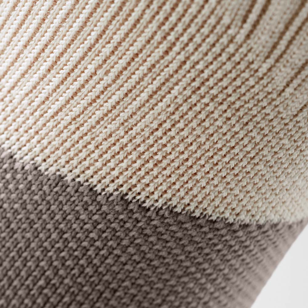 Close-up of a ribbed knit fabric showing a Bauerfeind sport outdoor ankle compression sleeve