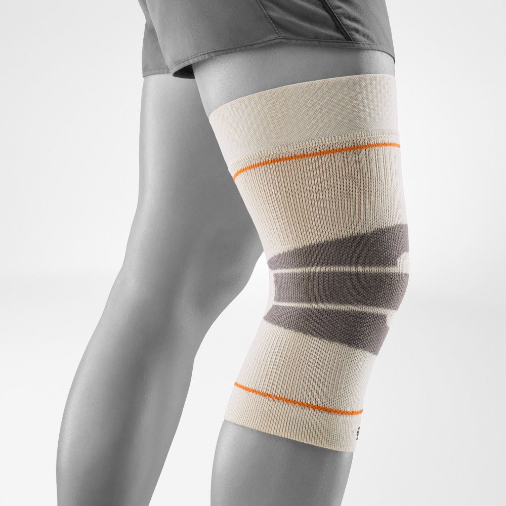 Knee support brace with gray and beige pattern on a white background