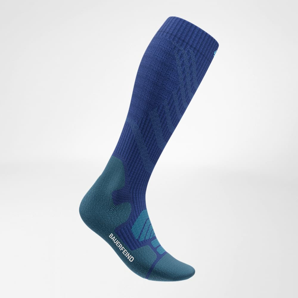 Blue knee-high sock with green gradient on a light gray background