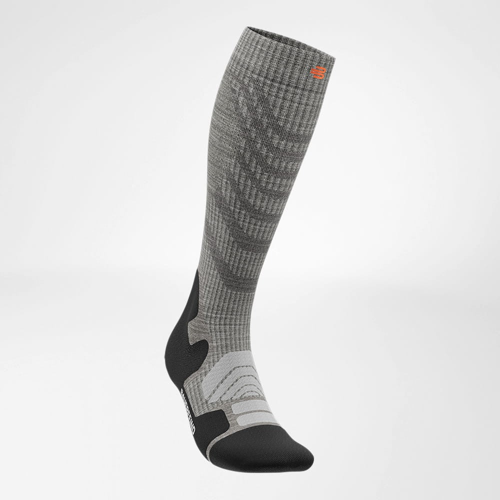 Gray and black knee-high sock on a light gray background