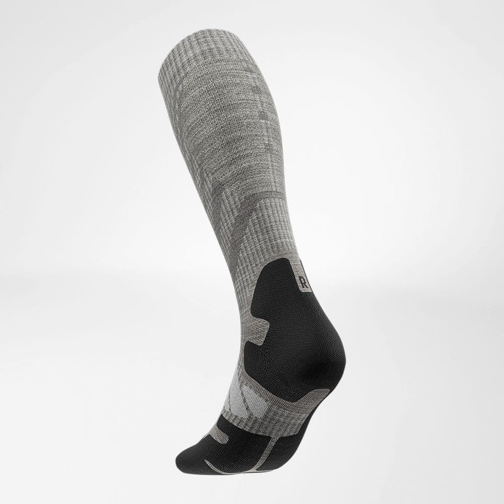 Gray and black knee-high sock on a light gray background