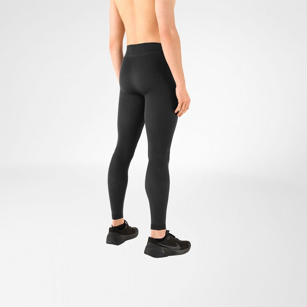 Person wearing bauerfeind sport mens compression leggings on a white background
