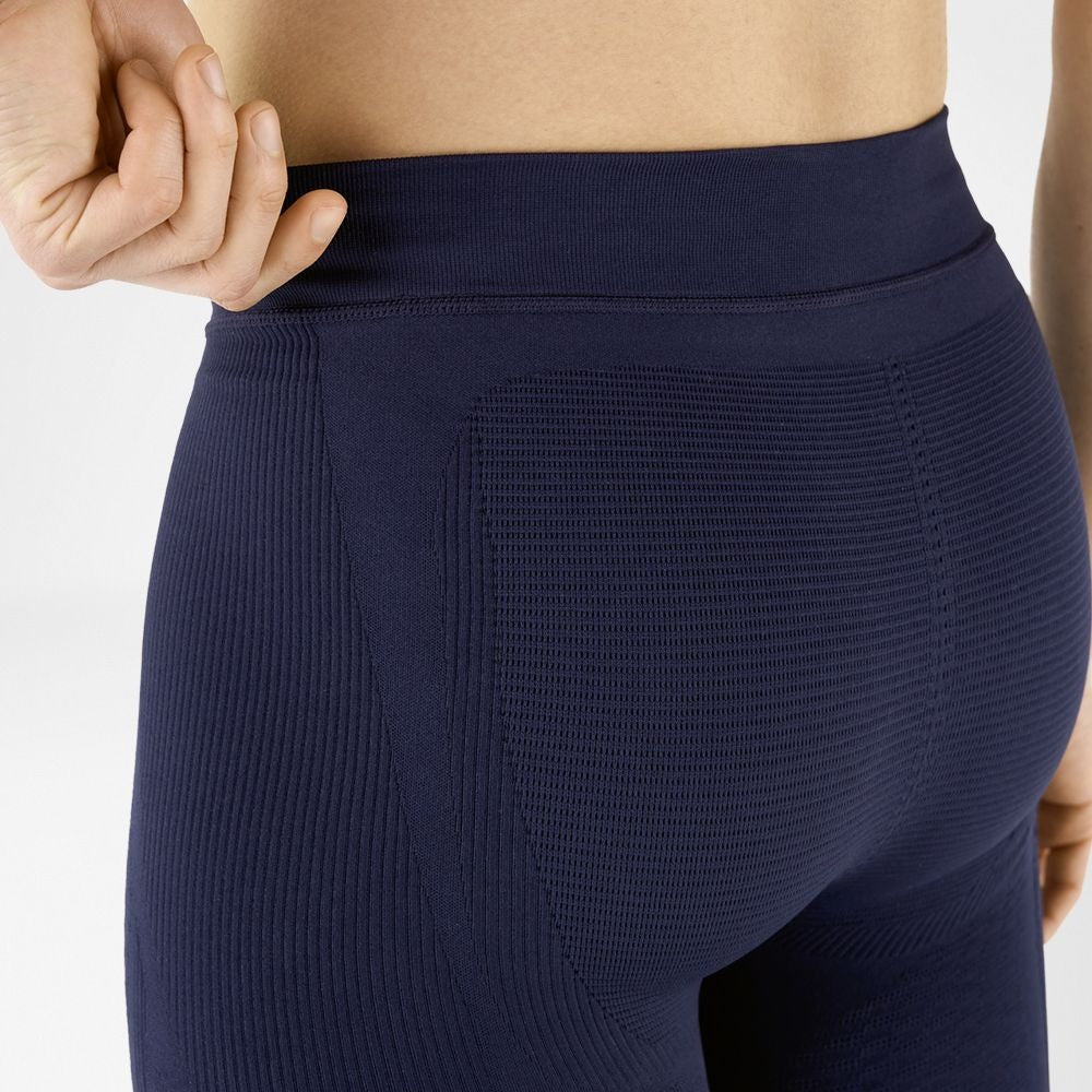 Navy blue bauerfeind compression wear leggings with textured pattern on a white background