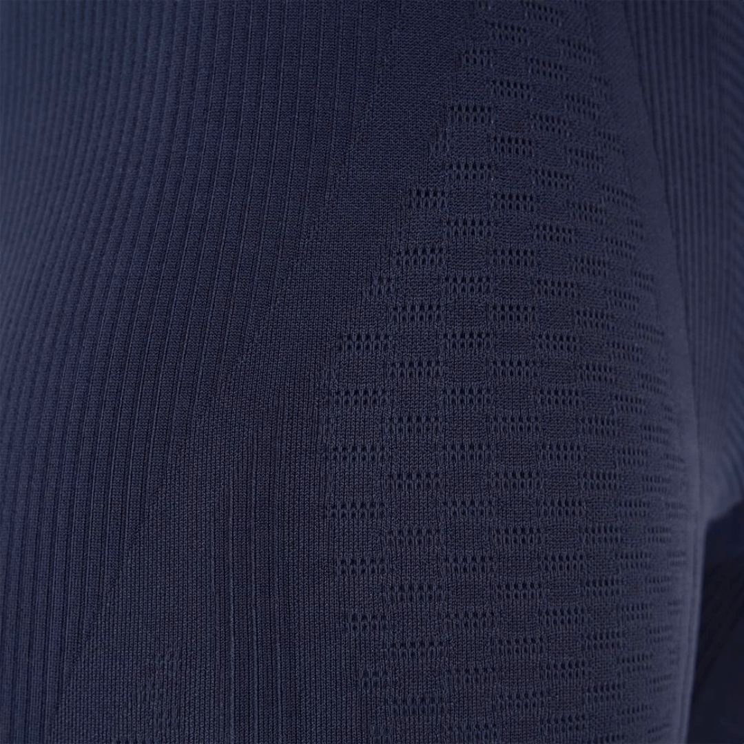 Close-up of a textured navy blue fabric on the bauerfeind sports compression collection