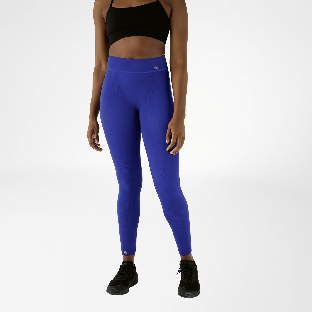 Person wearing blue athletic Bauerfeind Women's sport compression Leggings and black sports bra on a white background