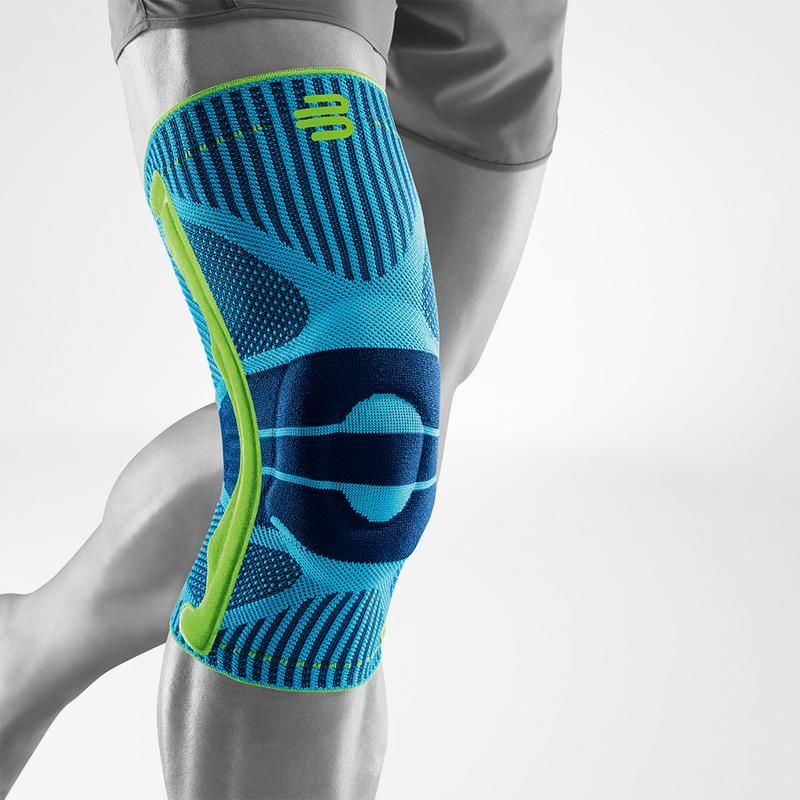 A blue and green sports knee support brace with black accents, shown applied to a person's leg.