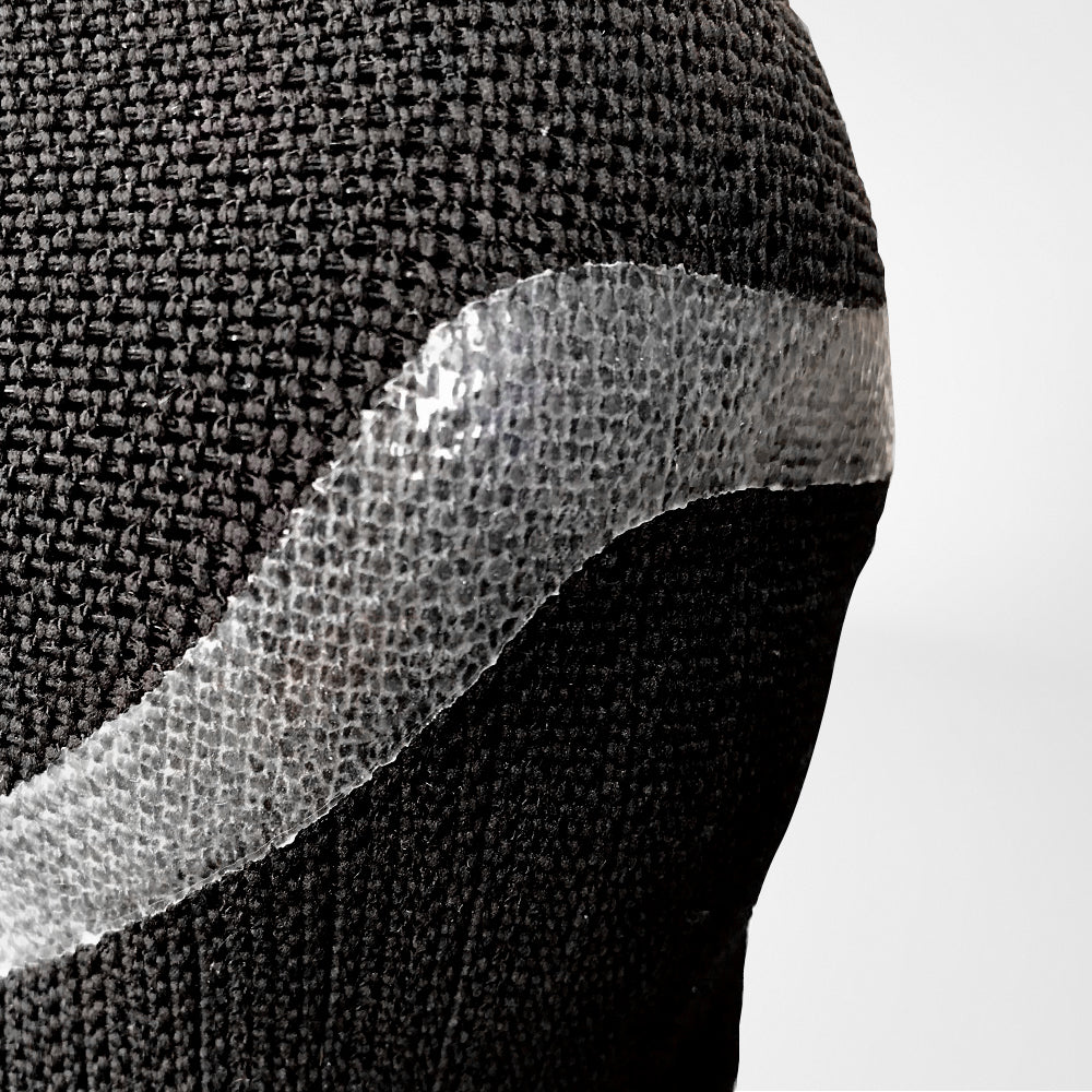 Closeup on a black Bauerfeind Sports Knee Support NBA