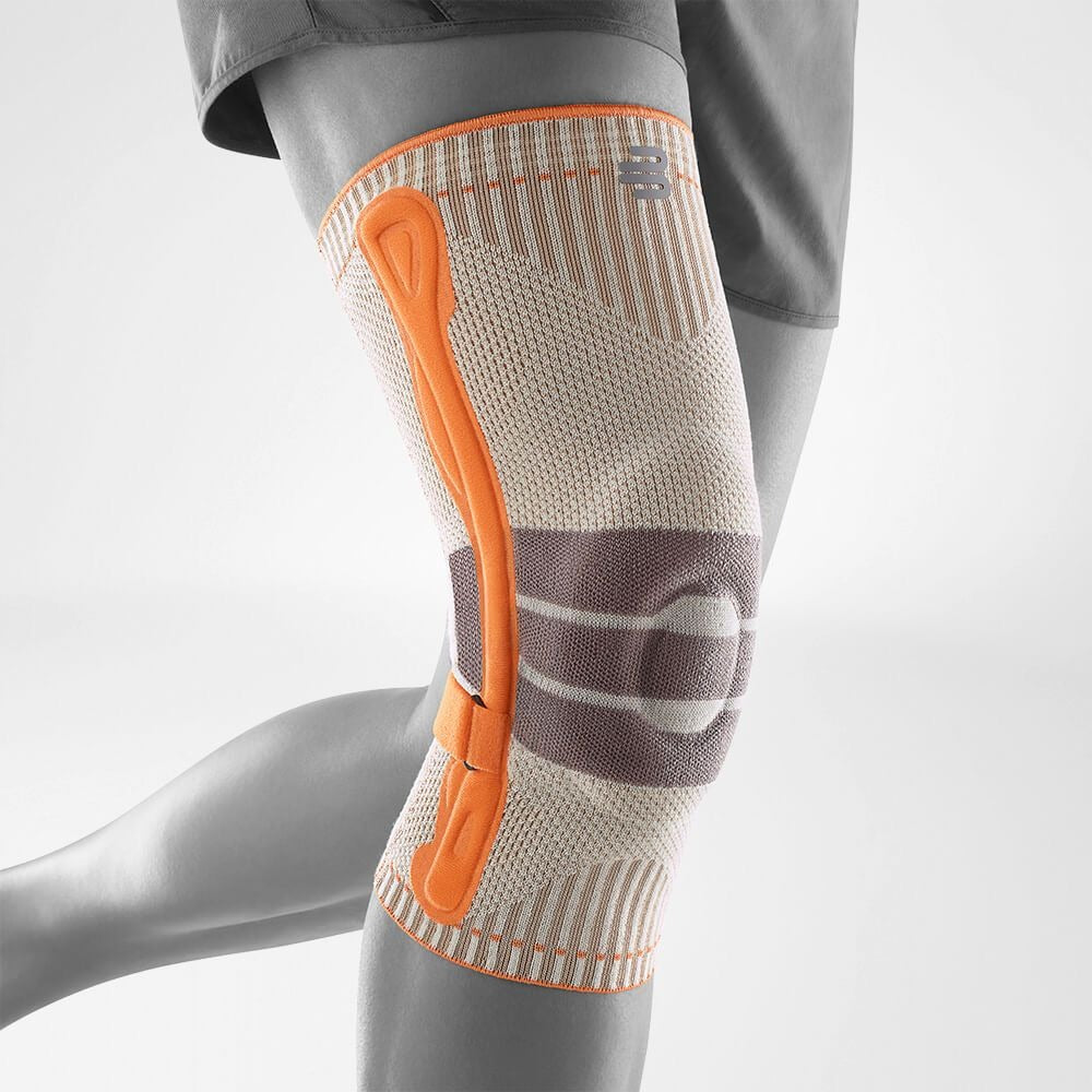 Knee brace with orange accent on a white background
