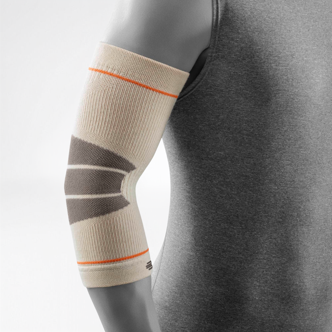 A close-up of a person's arm wearing a Bauerfeind Sports outdoor elbow compression sleeve with a light gray background.