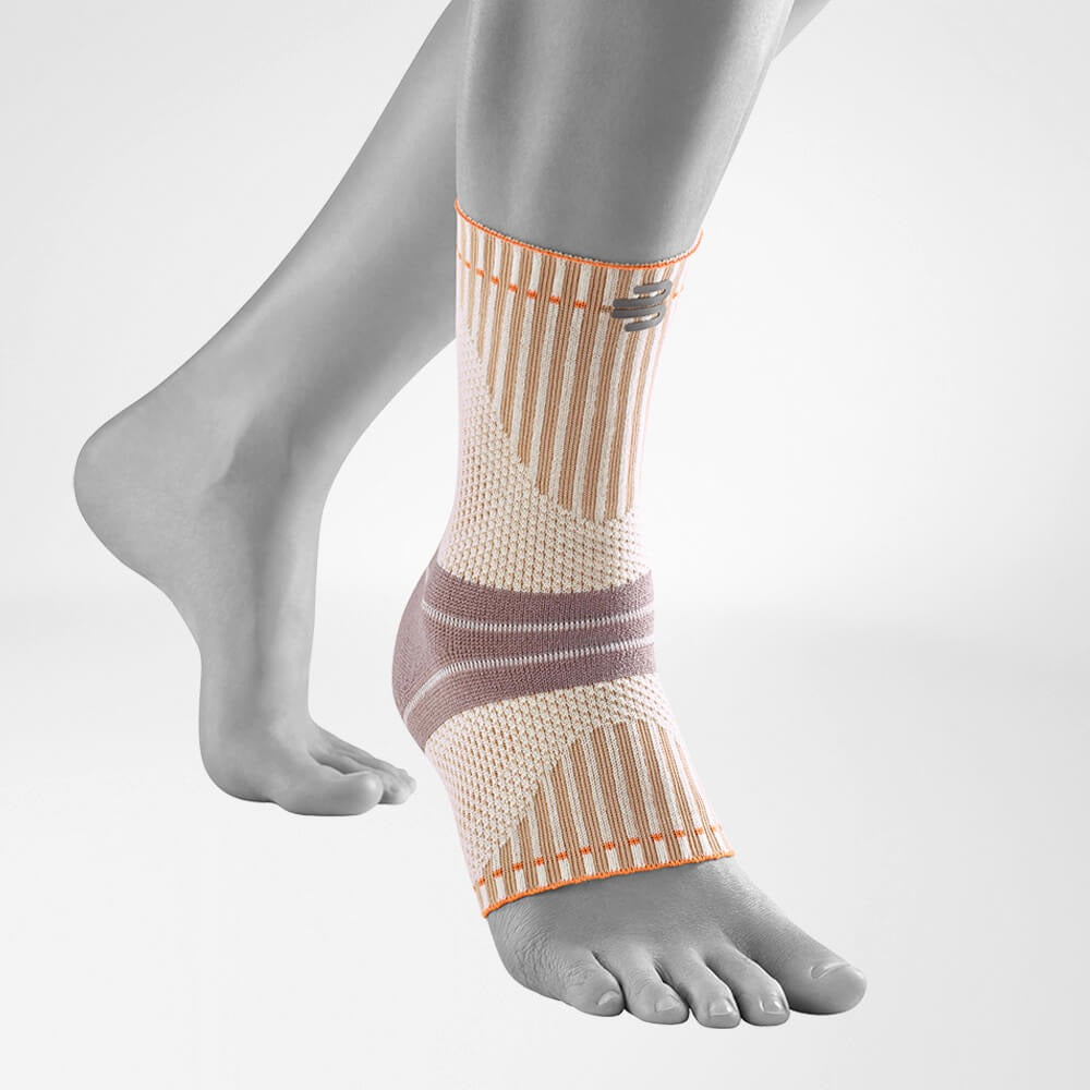 Ankle support brace on a gray mannequin leg against a light gray background