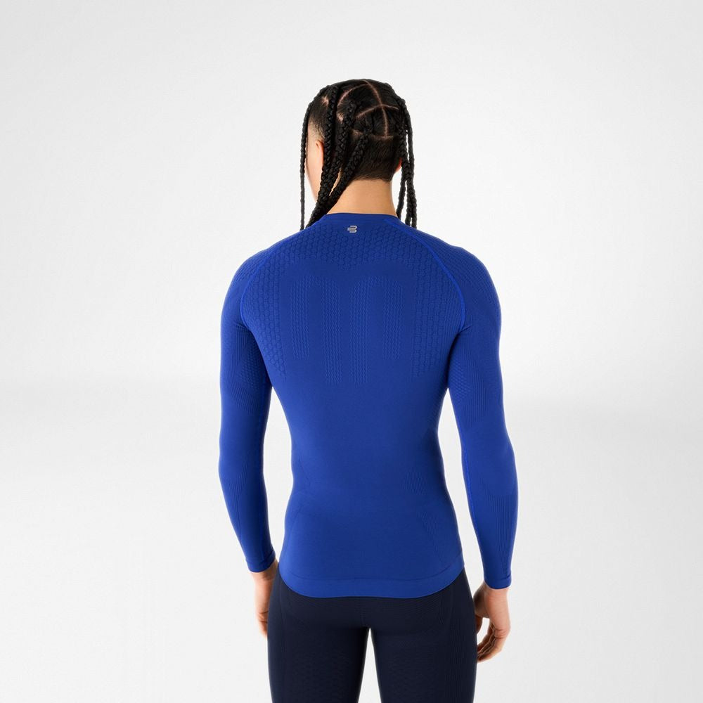 Person wearing blue athletic Bauerfeind men's Sports Compression long Sleeve Shirt and Navy blue Bauerfeind's Men Sport compression shorts on a white background
