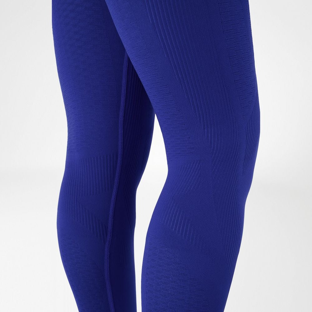 Person wearing blue athletic Bauerfeind Women's sport compression Leggings