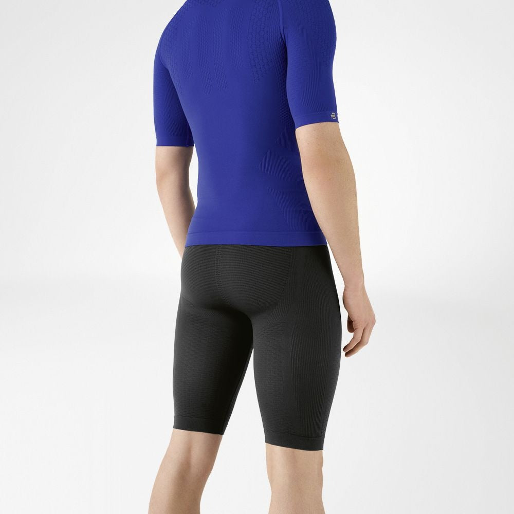 Person wearing blue athletic Bauerfeind men's Sports Compression Short Sleeve Shirt and grey Bauerfeind's Men Sport compression shorts on a white background