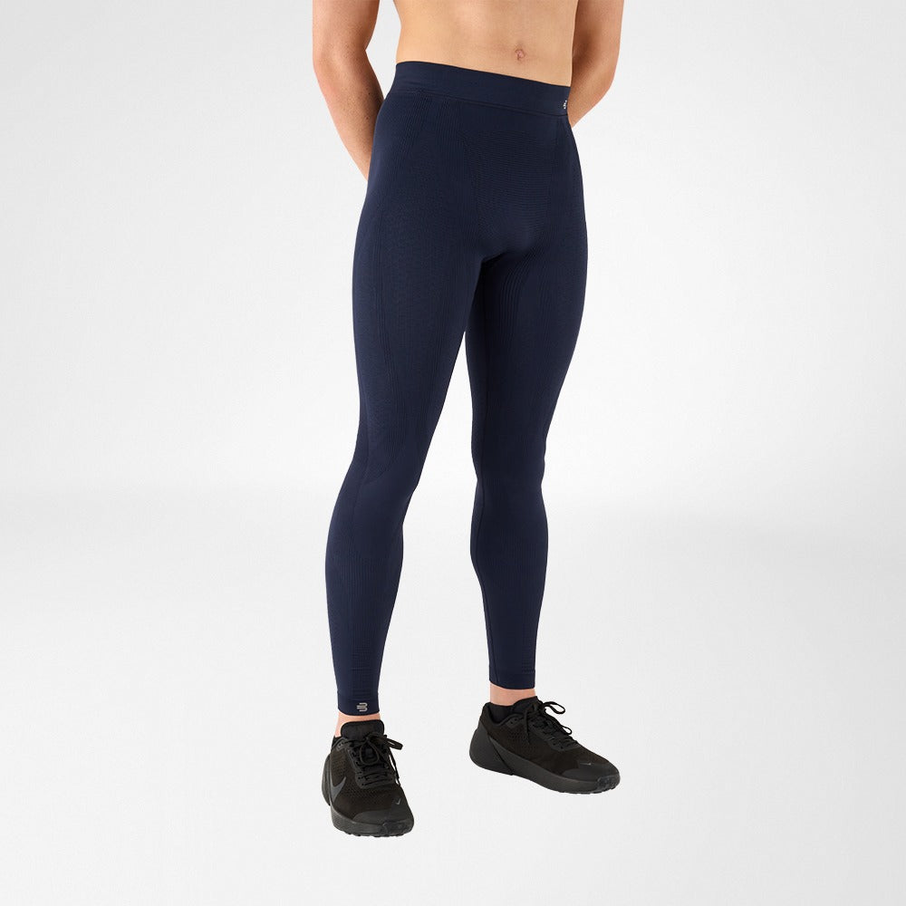 Person wearing Navy athletic Bauerfeind's Men Sport compression pants on a white background