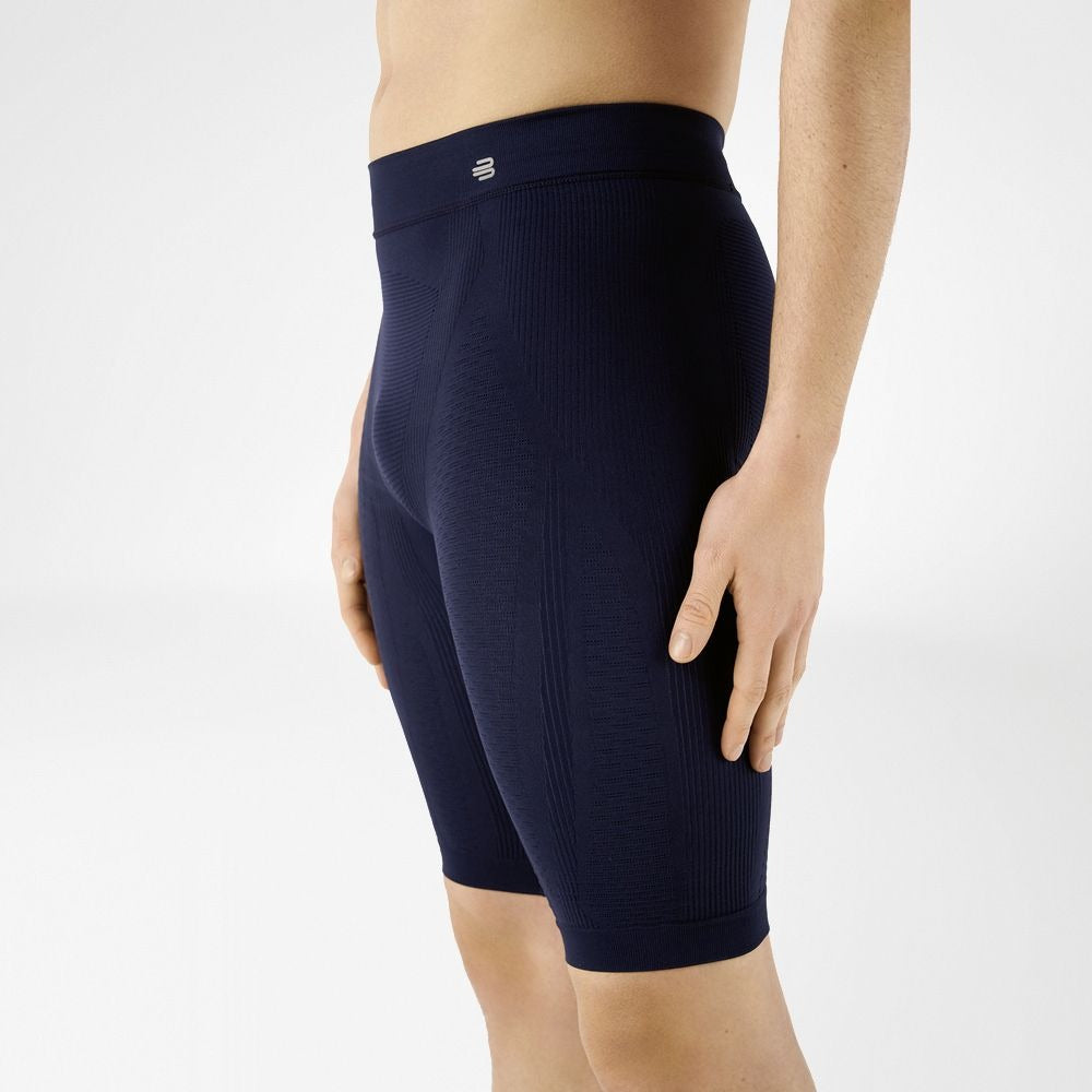 Navy blue Bauerfeind's Men Sport compression shorts worn by a person on a white background