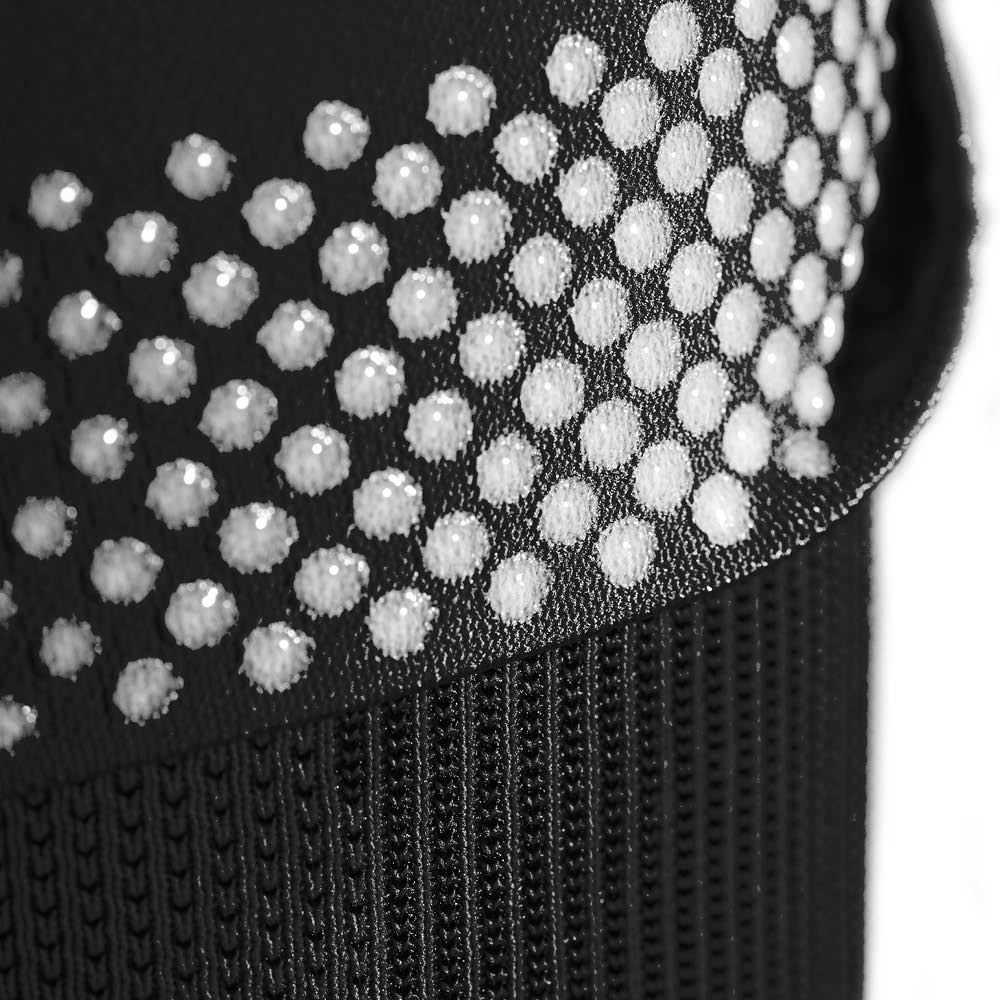 Closeup of the support band on a black bauerfeind Sports Compression Knee Support NBA